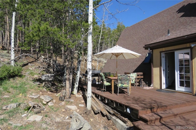 8691 S Warhawk Rd, Conifer, CO 80433 - wooden deck with outdoor dining area