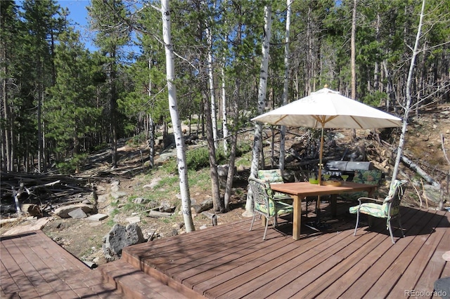 8691 S Warhawk Rd, Conifer, CO 80433 - wooden deck featuring outdoor dining area