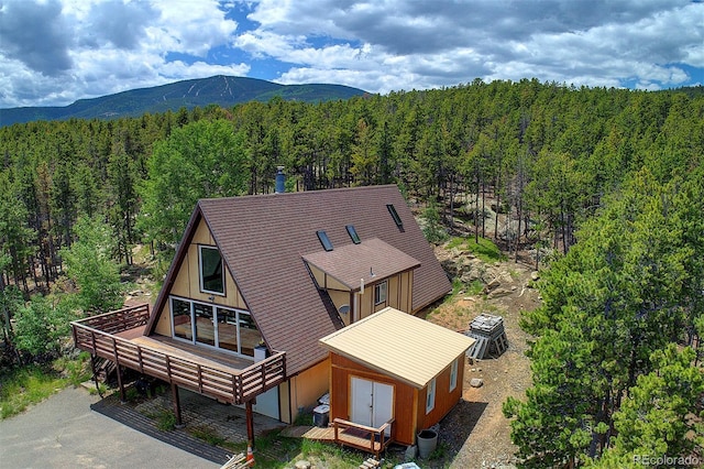 8691 S Warhawk Rd, Conifer, CO 80433 - aerial view of property and surrounding area featuring a forest and mountains