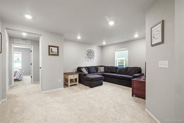 carpeted living room with a wealth of natural light