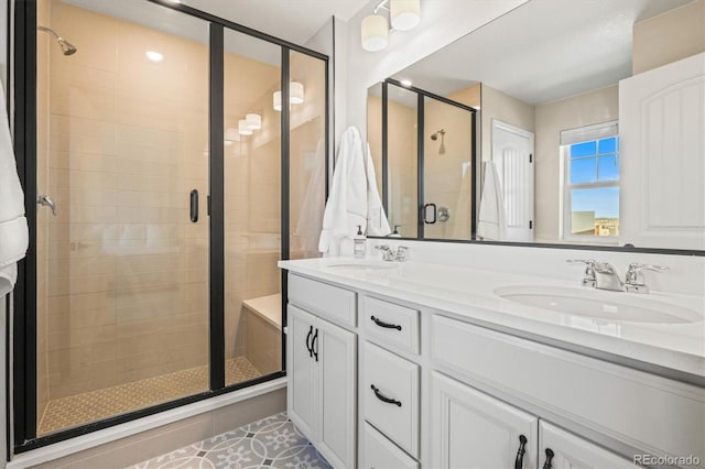 bathroom featuring vanity, an enclosed shower, and tile patterned floors