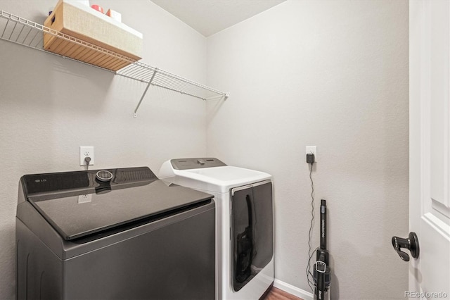 washroom with washer and clothes dryer