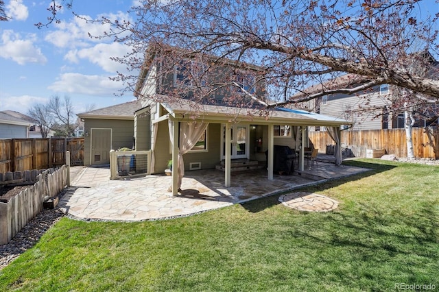 rear view of property featuring a patio area, a fenced backyard, and a lawn