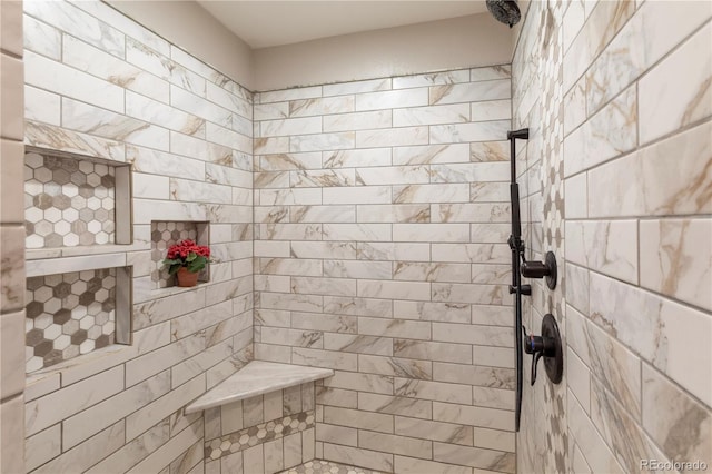 bathroom featuring tiled shower