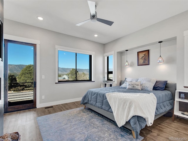 bedroom with visible vents, access to outside, wood finished floors, recessed lighting, and baseboards