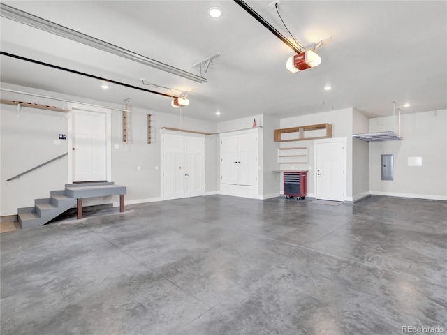 garage with recessed lighting, a garage door opener, and baseboards