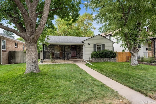 ranch-style house featuring a front lawn