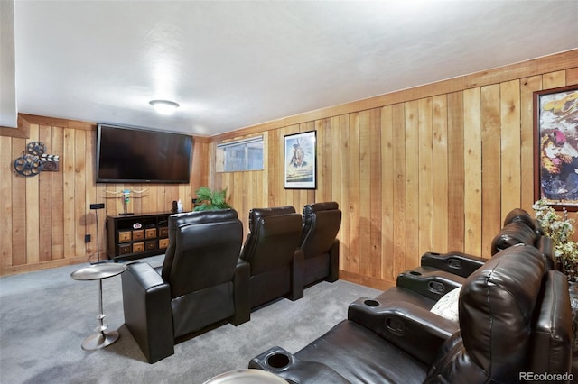 cinema room with light colored carpet and wooden walls