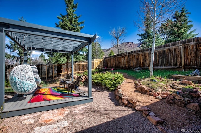 view of yard featuring a deck and a fenced backyard