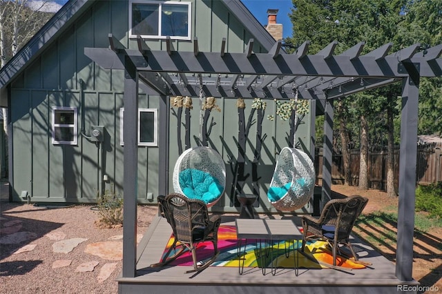 view of patio / terrace featuring a pergola, fence, and a deck