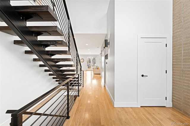 interior space with light hardwood / wood-style floors and a barn door