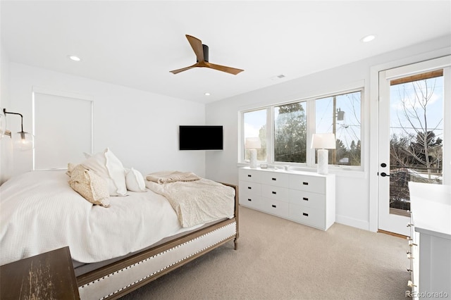 carpeted bedroom with multiple windows and ceiling fan