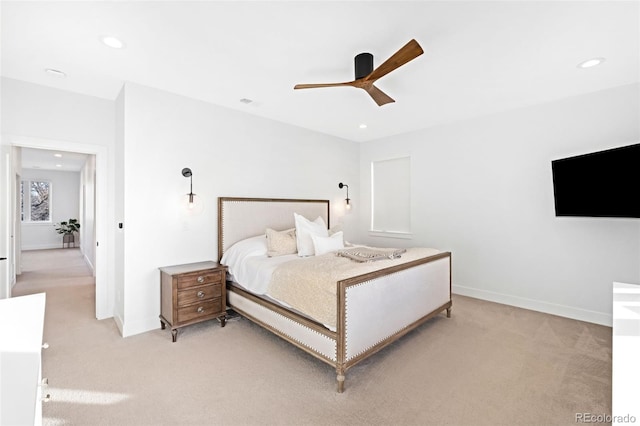 bedroom featuring light carpet and ceiling fan