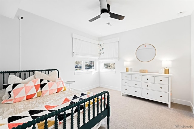 bedroom featuring ceiling fan and light carpet