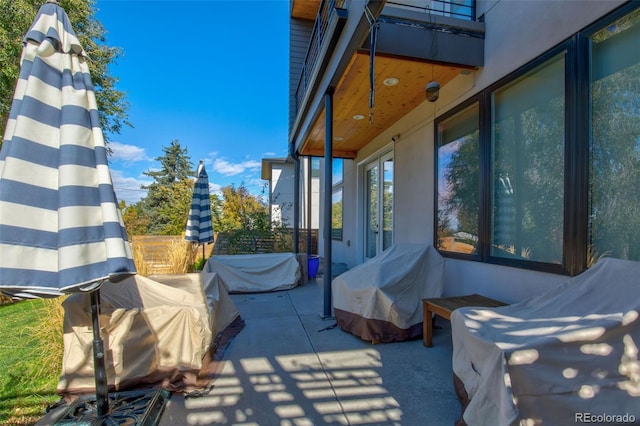 view of side of property featuring a patio area