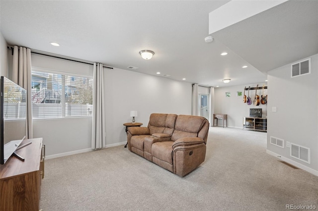 living room with light colored carpet and visible vents