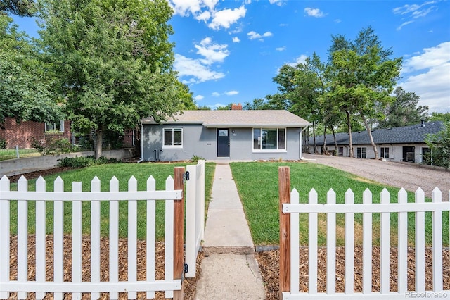 ranch-style house with a front lawn