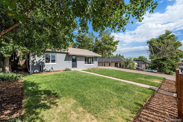 ranch-style house featuring a front lawn