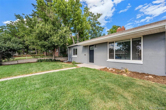 exterior space featuring a front lawn