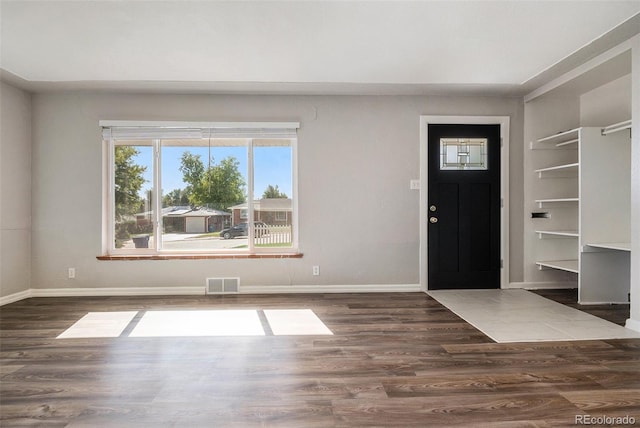 foyer with dark hardwood / wood-style floors