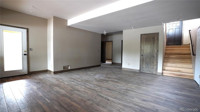 unfurnished room featuring dark hardwood / wood-style floors