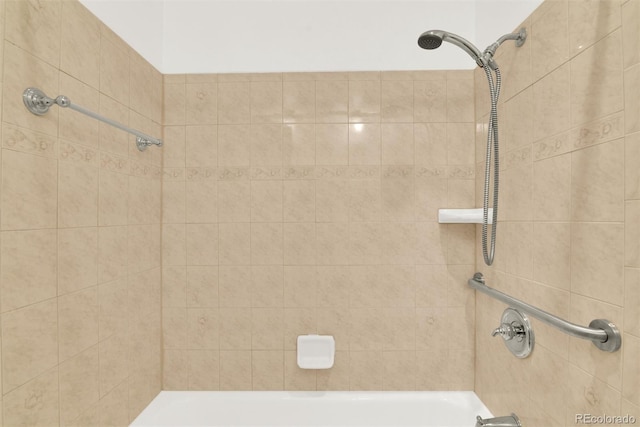 bathroom featuring washtub / shower combination