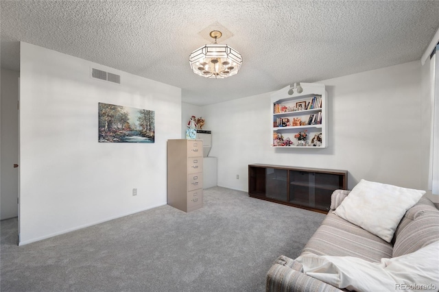 living area featuring carpet and a textured ceiling