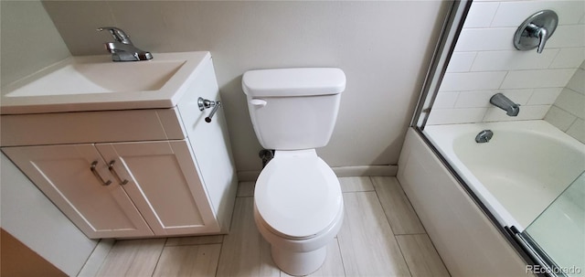 full bathroom with vanity, toilet, baseboards, and wood tiled floor