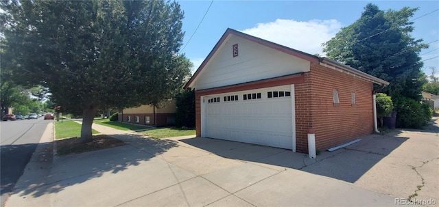 2903-2905 W 39th Ave, Denver, CO 80211 - view of side of home with brick siding, an outbuilding, and a detached garage