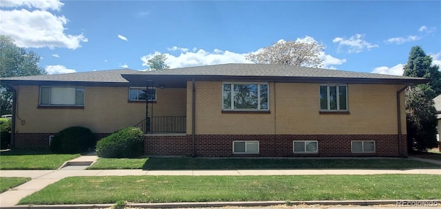 2903-2905 W 39th Ave, Denver, CO 80211 - view of home's exterior with a yard and brick siding