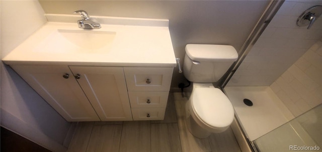 2903-2905 W 39th Ave, Denver, CO 80211 - bathroom with toilet, a stall shower, and vanity