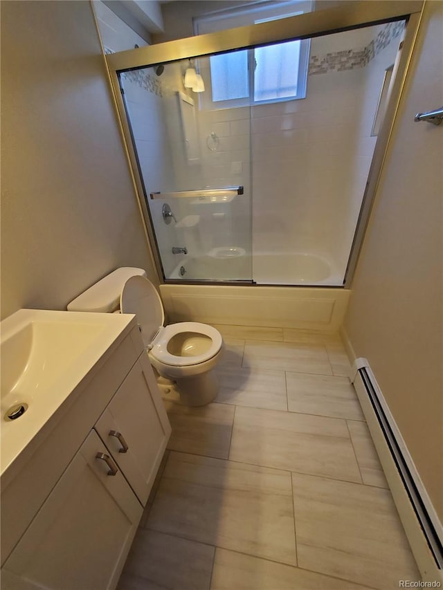2903-2905 W 39th Ave, Denver, CO 80211 - full bathroom featuring a baseboard radiator, vanity, bath / shower combo with glass door, toilet, and tile patterned flooring