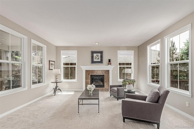 8993 Stonecrest Way, Highlands Ranch, CO 80129 - living room featuring light carpet, a high end fireplace, and baseboards