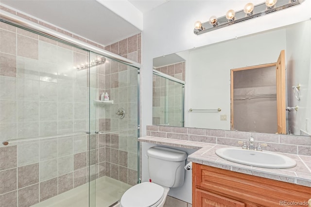 8993 Stonecrest Way, Highlands Ranch, CO 80129 - full bath featuring toilet, vanity, a stall shower, and a walk in closet