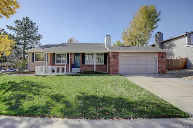 ranch-style house featuring a porch, a front lawn, and a garage