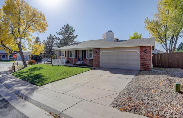 ranch-style home with a front yard and a garage