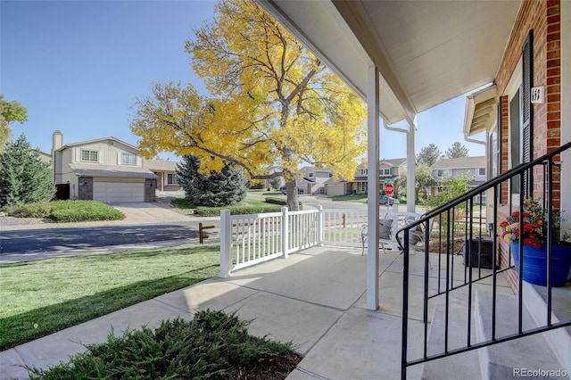 view of patio with covered porch and a garage