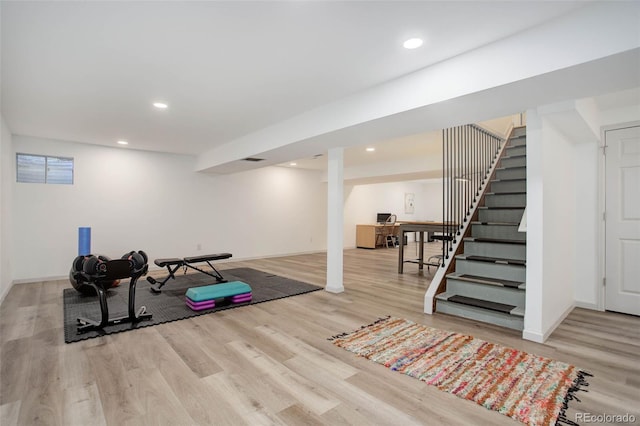 exercise room featuring light hardwood / wood-style flooring