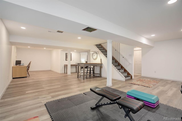 workout area featuring light hardwood / wood-style flooring