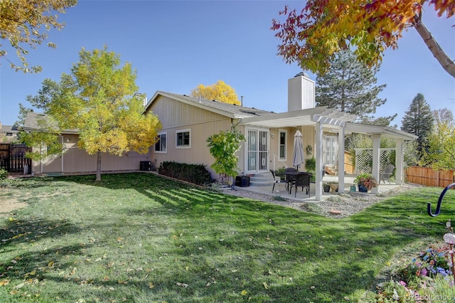 back of house featuring a patio area, central AC, a lawn, and a pergola