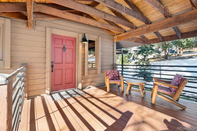 view of exterior entry featuring a porch