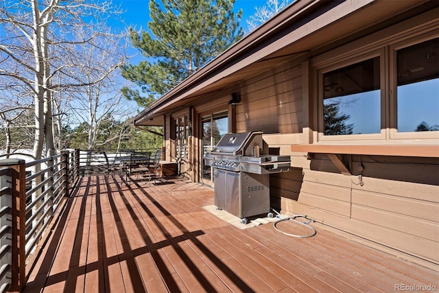 wooden terrace featuring area for grilling