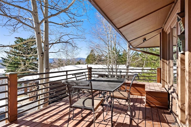 view of snow covered deck