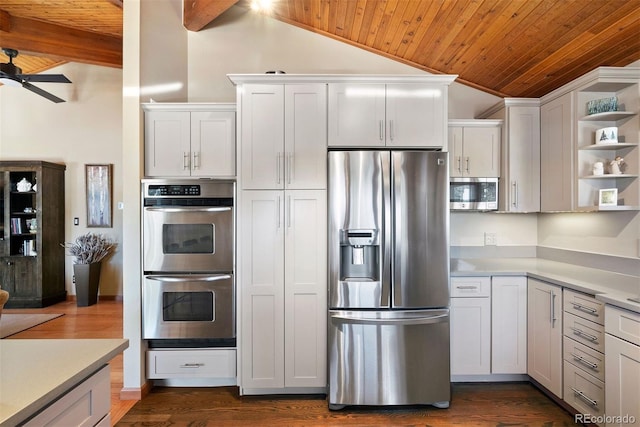 kitchen featuring white cabinetry, wooden ceiling, vaulted ceiling with beams, dark hardwood / wood-style floors, and appliances with stainless steel finishes