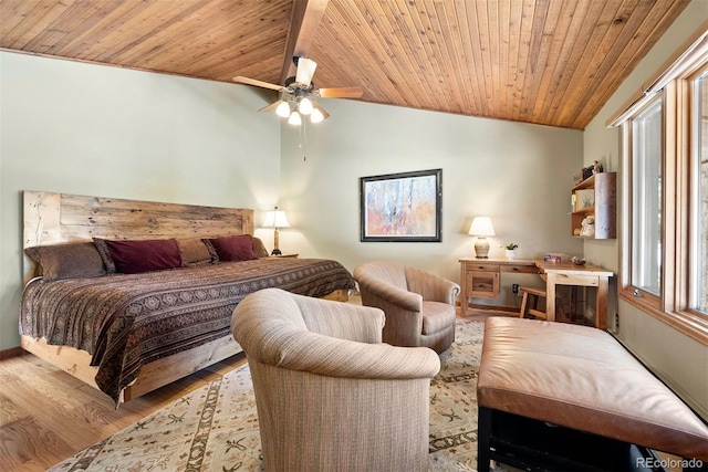 bedroom with ceiling fan, light hardwood / wood-style floors, wood ceiling, and vaulted ceiling