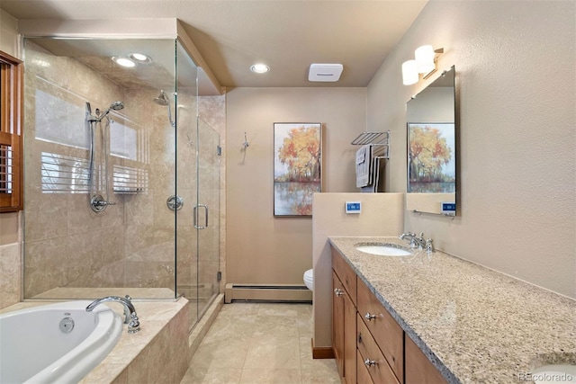 full bathroom featuring tile patterned floors, vanity, separate shower and tub, a baseboard heating unit, and toilet