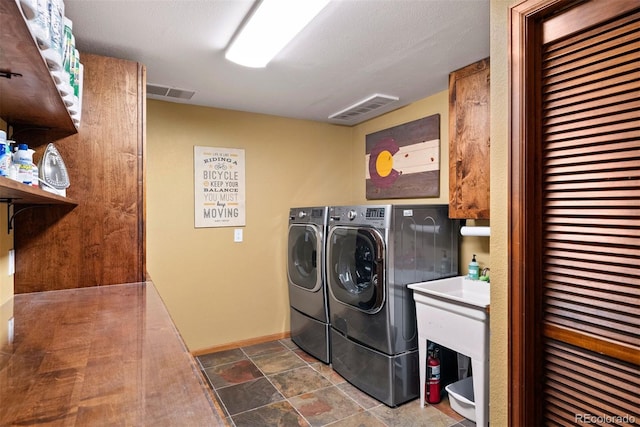 washroom featuring independent washer and dryer