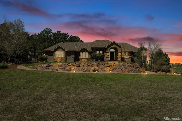 19336 Queens Crescent Way, Monument, CO 80132 - view of front facade featuring stone siding and a lawn