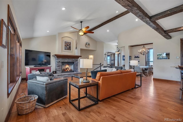 19336 Queens Crescent Way, Monument, CO 80132 - living room with baseboards, light wood finished floors, a fireplace, a chandelier, and recessed lighting