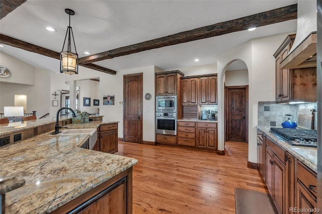 19336 Queens Crescent Way, Monument, CO 80132 - kitchen with stainless steel appliances, a sink, recessed lighting, decorative backsplash, and beam ceiling